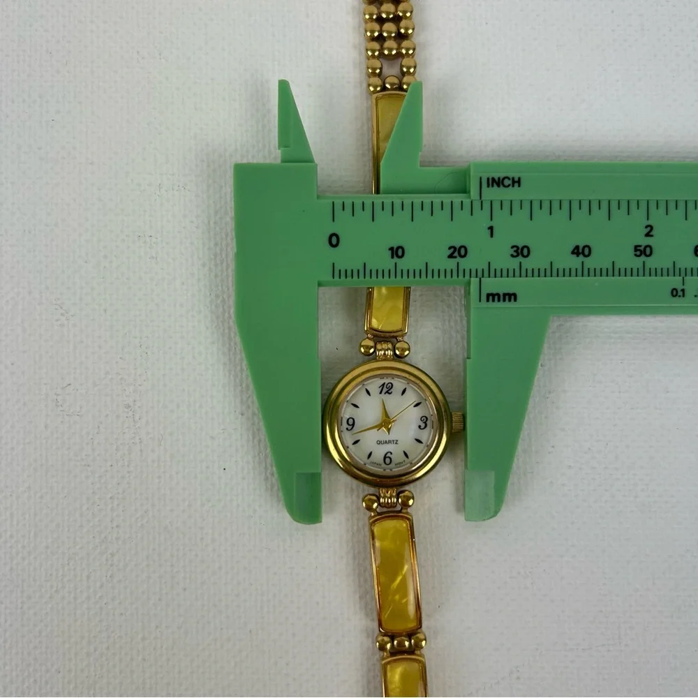 Elegant Avon Gold Tone Watch with Yellow Accents, 1